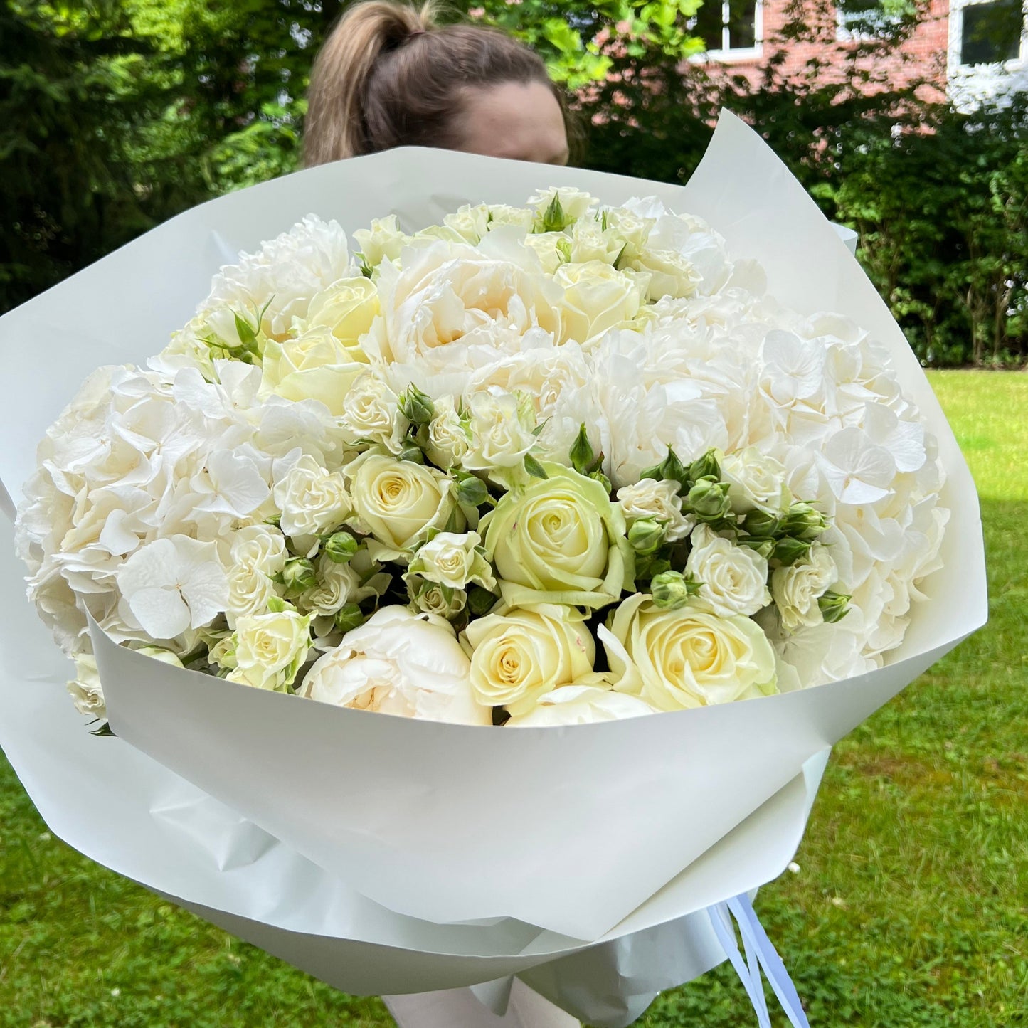 White bush rose, white avalanche rose and white hydrangeas bouquet